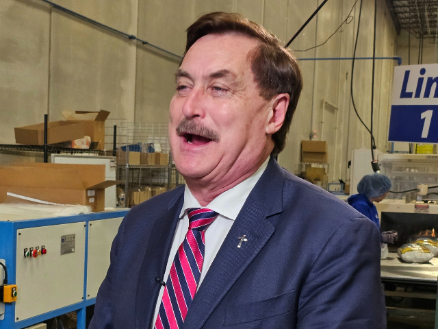 MyPillow CEO and founder Mike Lindell speaks to reporters at his MyPillow factory in the M