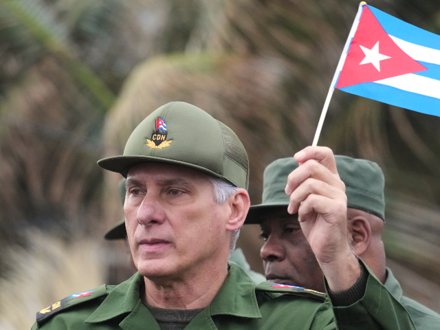 AP26016541319650 Cuban President Miguel Diaz-Canel marches during a rally to protest the killing of Cuban o