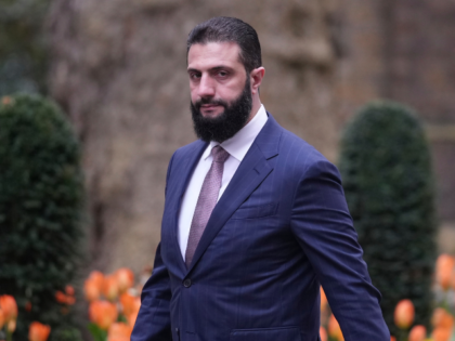 President of Syria Ahmed al-Sharaa walks towards 10 Downing Street to meet Britain's