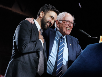 New York City Mayor Zohran Mamdani, left, hugs Sen. Bernie Sanders, I-Vt., right, during a