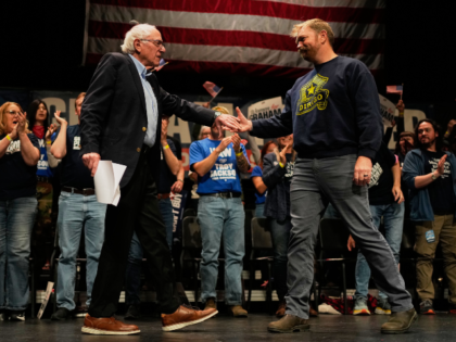 Sen. Bernie Sanders, left, greets Graham Platner, Democratic candidate for U.S. Senate, at