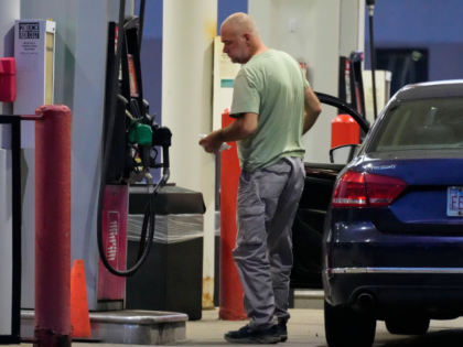 AP26177444562337 A customer checks on gas price at a gas station in Buffalo Grove, Thursday, June 25, 2026.