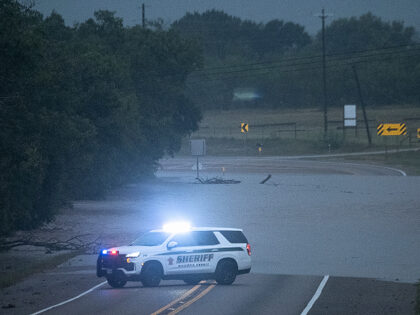 AP26197467350313 (1) The Pedernales River floods along State Highway 16 on Thursday, July 16, 2026, in Frederic