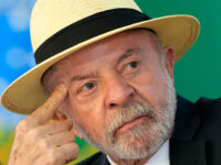 Title: Brazil U.S. Tariffs Image ID: 26203708310936 Article: Brazilian President Luiz Inacio Lula da Silva attends a ceremony to sign a bill allocating funds for credit lines under a program that supports Brazilian companies affected by U.S. tariffs, in Brasilia, Brazil, Wednesday, July 22, 2026. (AP Photo/Eraldo Peres)