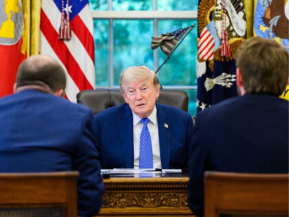 President Donald Trump speaks with Breitbart News Washington Bureau Chief Matthew Boyle (l
