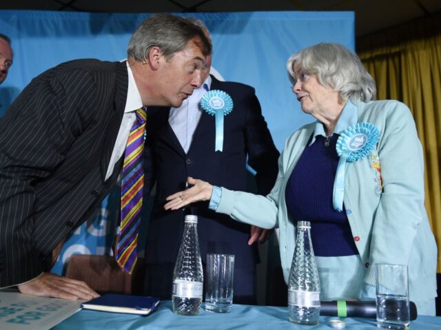 Brexit Party leader Nigel Farage (L) talks with candidate Ann Widdecombe (R) at a European