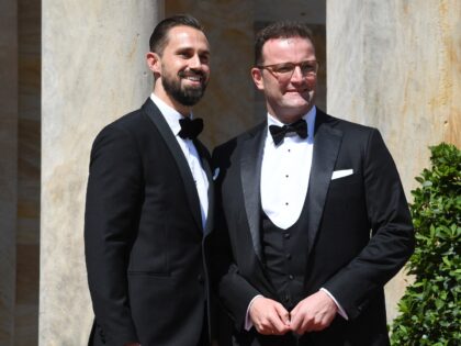 German Health Minister Jens Spahn (R) and his husband Daniel Funke arrive for the opening