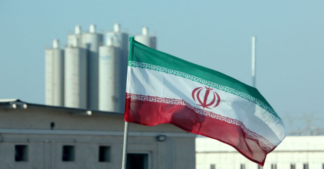 A picture taken on November 10, 2019, shows an Iranian flag in Iran's Bushehr nuclear power plant, during an official ceremony to kick-start works on a second reactor at the facility. - Bushehr is Iran's only nuclear power station and is currently running on imported fuel from Russia that is closely monitored by the UN's International Atomic Energy Agency. (Photo by ATTA KENARE / AFP) (Photo by ATTA KENARE/AFP via Getty Images)