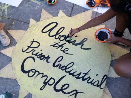NEW YORK, USA - JUNE 24: A Black Lives Matter protestor prepares a banner at City Hall acr