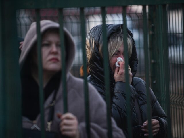 MEDYKA, POLAND - FEBRUARY 25: An Ukrainian cries as she waits for relatives at the Medyka