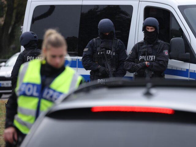 FRANKFURT AN DER ODER, GERMANY - OCTOBER 05: Heavily-armed German police look on as a fema