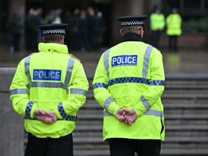 Police officers stand on duty outside The Queen Elizabeth II Law Courts in Liverpool, nort