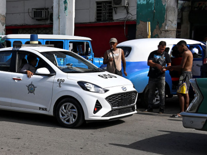 A police vehicle patrols a street on the fourth anniversary of anti-government protests in