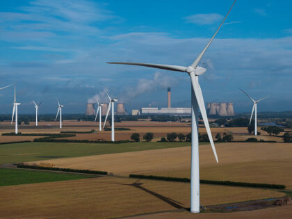 In Focus - Drax Power Station AIRMYN, ENGLAND - JULY 20: Wind turbines stand in front of Drax Power Station, operated by