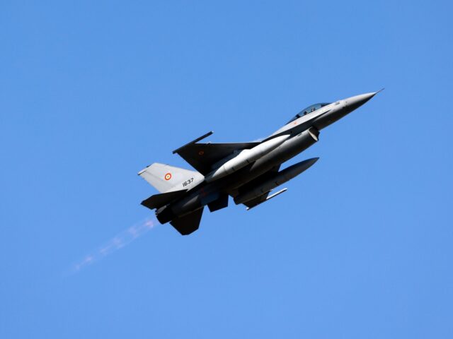 A Romanian Air Force military pilot performs on an F-16 Fighting Falcon jet during the Buc