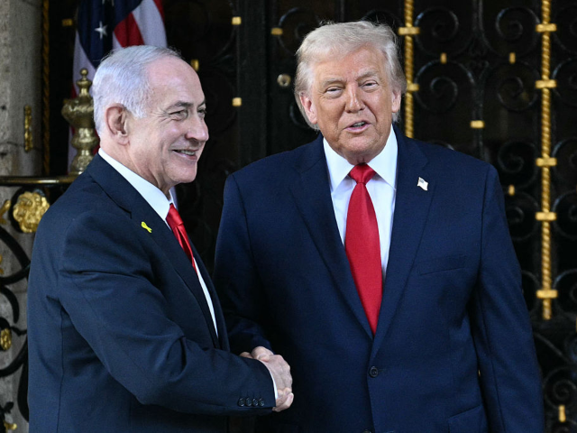 US President Donald Trump (R) greets Israeli Prime Minister Benjamin Netanyahu (L) upon ar