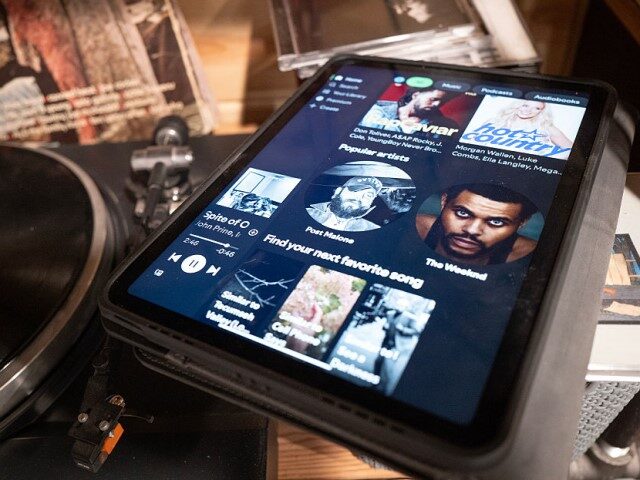 A music selection is shown on a Spotify app on February 10, 2026 in Chicago, Illinois. Spo