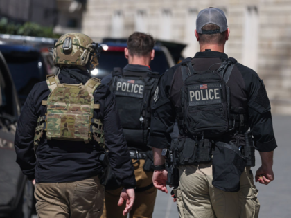 Secret Service and Counter Assault Team police is seen ahead Hungarian Prime Minister Vikt