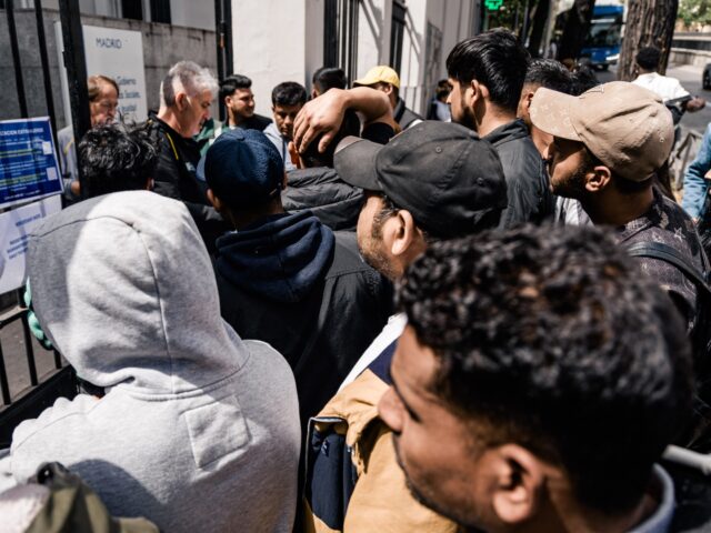 SPAIN - APRIL 21: Several people queue at a Social Services office, on 21 April, 2026 in M
