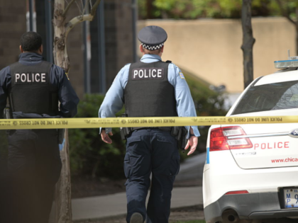 CHICAGO, UNITED STATES - APRIL 25: Chicago police officers stand outside a nearby hospital