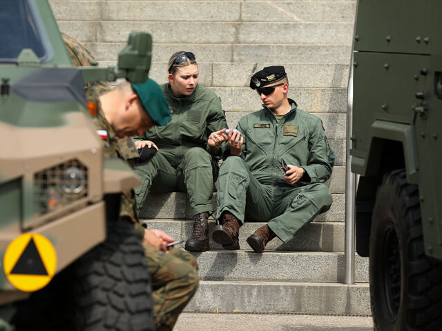 Polish soldiers with vehicles are seen during the Defence24 Days exhibition at the Nationa