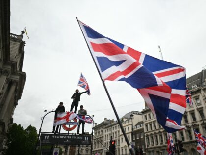On Whitehall, supporters of British far-right activist Tommy Robinson, real name Stephen Y