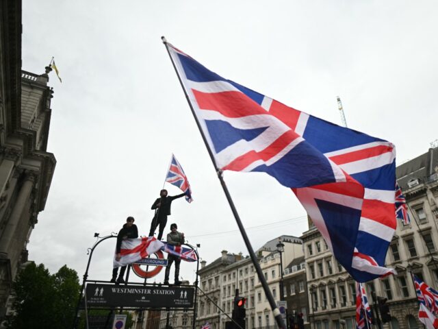 On Whitehall, supporters of British far-right activist Tommy Robinson, real name Stephen Y