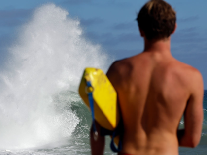 NEWPORT BEACH, CALIFORNIA - JUNE 10: A lifeguard keeps watch as waves break at The Wedge,