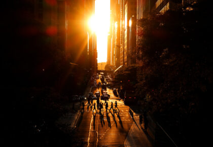 NEW YORK, NY - JUNE 15: People cross 42nd Street as the sun sets on June 15, 2026, in New