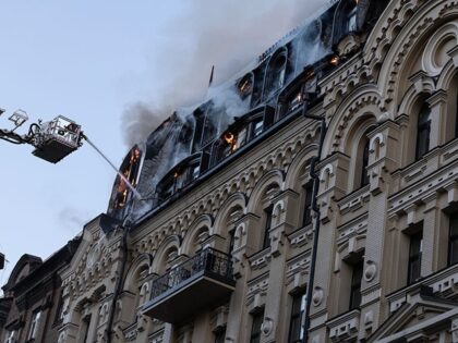 KYIV, UKRAINE - JULY 2: Firefighters extinguish a fire at the City hotel residence after a