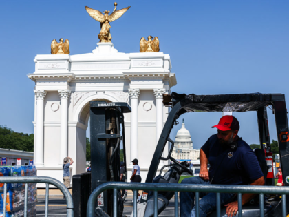 WASHINGTON, DC - JULY 02: A worker refills water in front of a replica of President Trump'