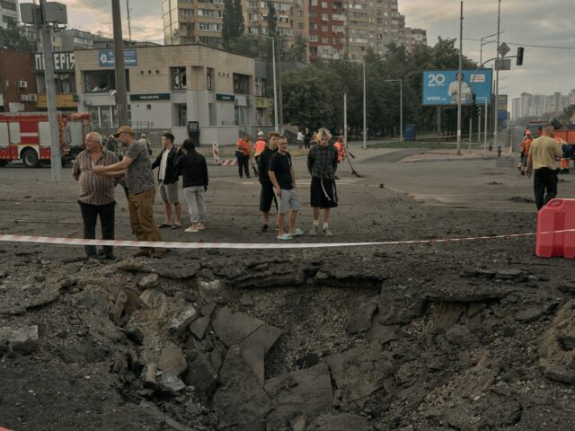 KYIV, UKRAINE - JULY 11: Municipal workers clear debris and repair damage after a Russian