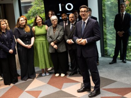 MANCHESTER, ENGLAND - JULY 24: Prime Minister Andy Burnham welcomes staff as he officially