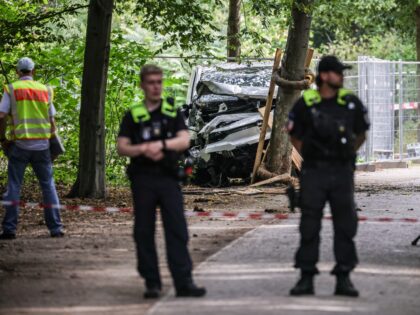 BERLIN, GERMANY - JULY 26: German police stand near a white van that suspect Abdul B. used