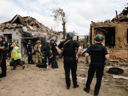 Emergency services work at the scene of a crash in Kharkiv, Ukraine, on July 26, 2026. On