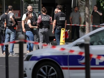 Judicial police work in a cordoned off area after a knife-wielding man wounded three peopl