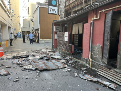 TOPSHOT - The exterior wall of a shop is seen collapsed in an earthquake, in Kumamoto City