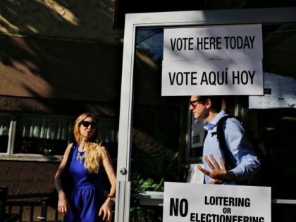 People exit a polling station after casting their vote during New Jersey's primary el