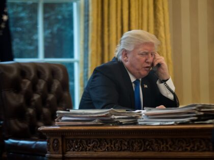 WASHINGTON, DC - JANUARY 28: President Donald Trump speaks on the phone with Chancellor of