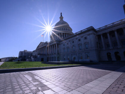 The sun shines over the US Capitol Building on an autumn afternoon in Washington DC on Nov