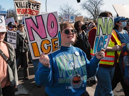 A demonstrator holds a placard reading ''no ice'' during a rally and demonstration at Jack