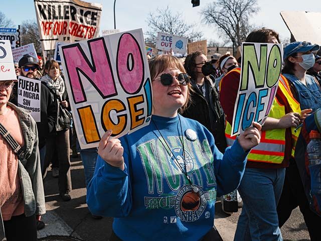 A demonstrator holds a placard reading ''no ice'' during a rally and demonstration at Jack