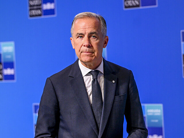 Canadian Prime Minister Mark Carney makes a statement to the press ahead of the main sessi