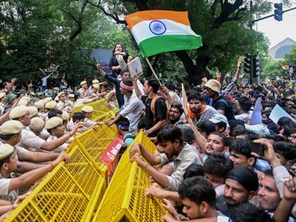 Activists and supporters of the Cockroach Janta Party (CJP) clash with police personnel du