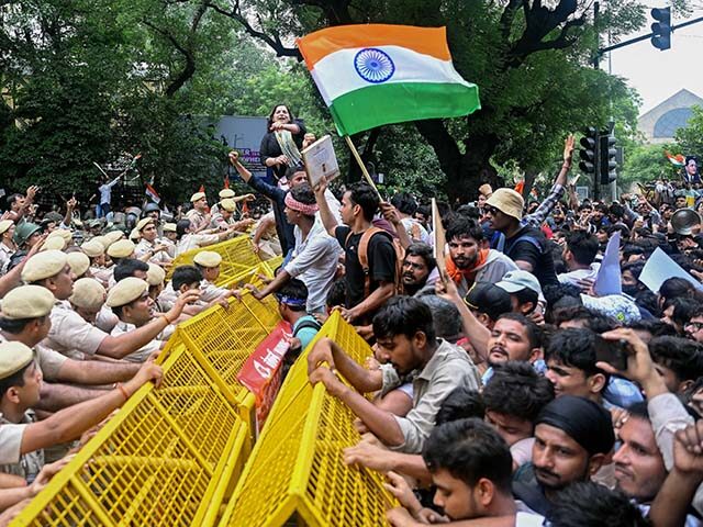 Activists and supporters of the Cockroach Janta Party (CJP) clash with police personnel du