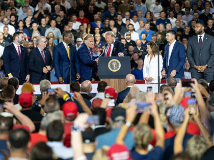 US President Donald Trump, center, and former Representative Mike Rogers, a Republican fro