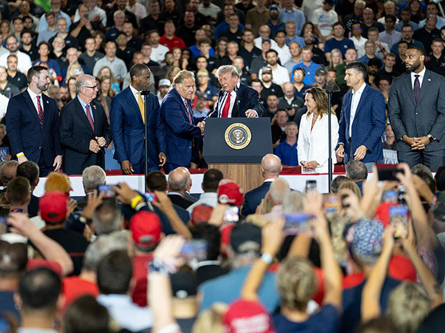 GettyImages2287281730 US President Donald Trump, center, and former Representative Mike Rogers, a Republican fro