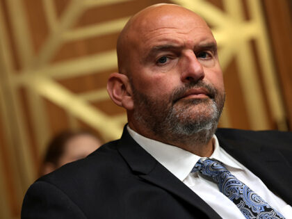 U.S. Sen. John Fetterman (D-PA) listens as former NIH Director Anthony Fauci testifies to
