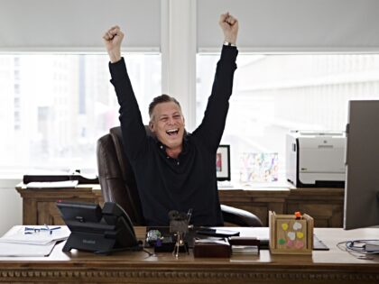 Jason Cloth, founder and chief executive officer of Creative Wealth Media, celebrates Joke