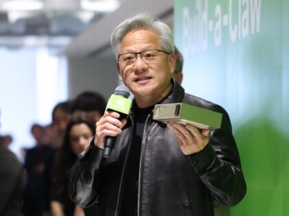 Jensen Huang holding AI chip China wants to Smuggle